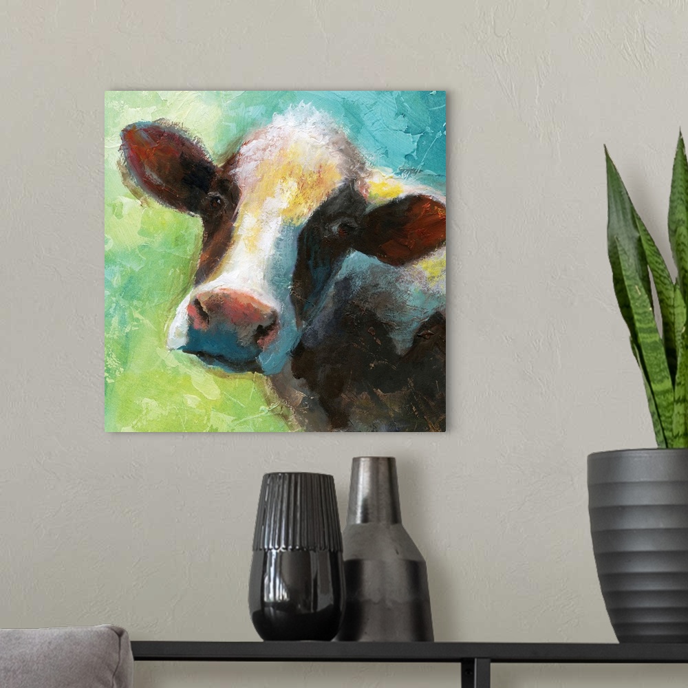 A modern room featuring A colorful painting of a cow.