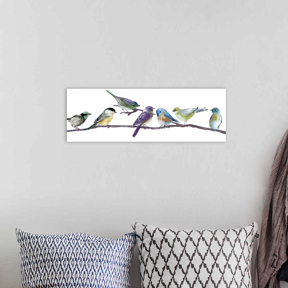 A bohemian room featuring Brightly colored songbirds perched in a row on a branch.