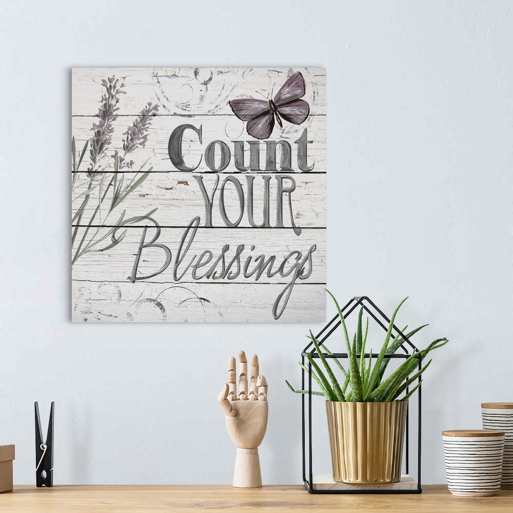 A bohemian room featuring "Count Your Blessings" handwritten on distressed shiplap.