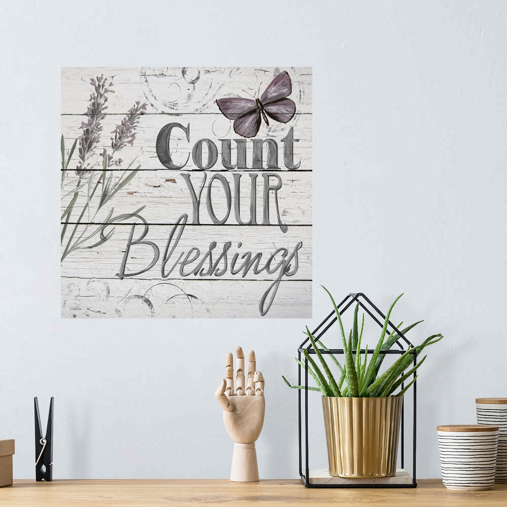 A bohemian room featuring "Count Your Blessings" handwritten on distressed shiplap.