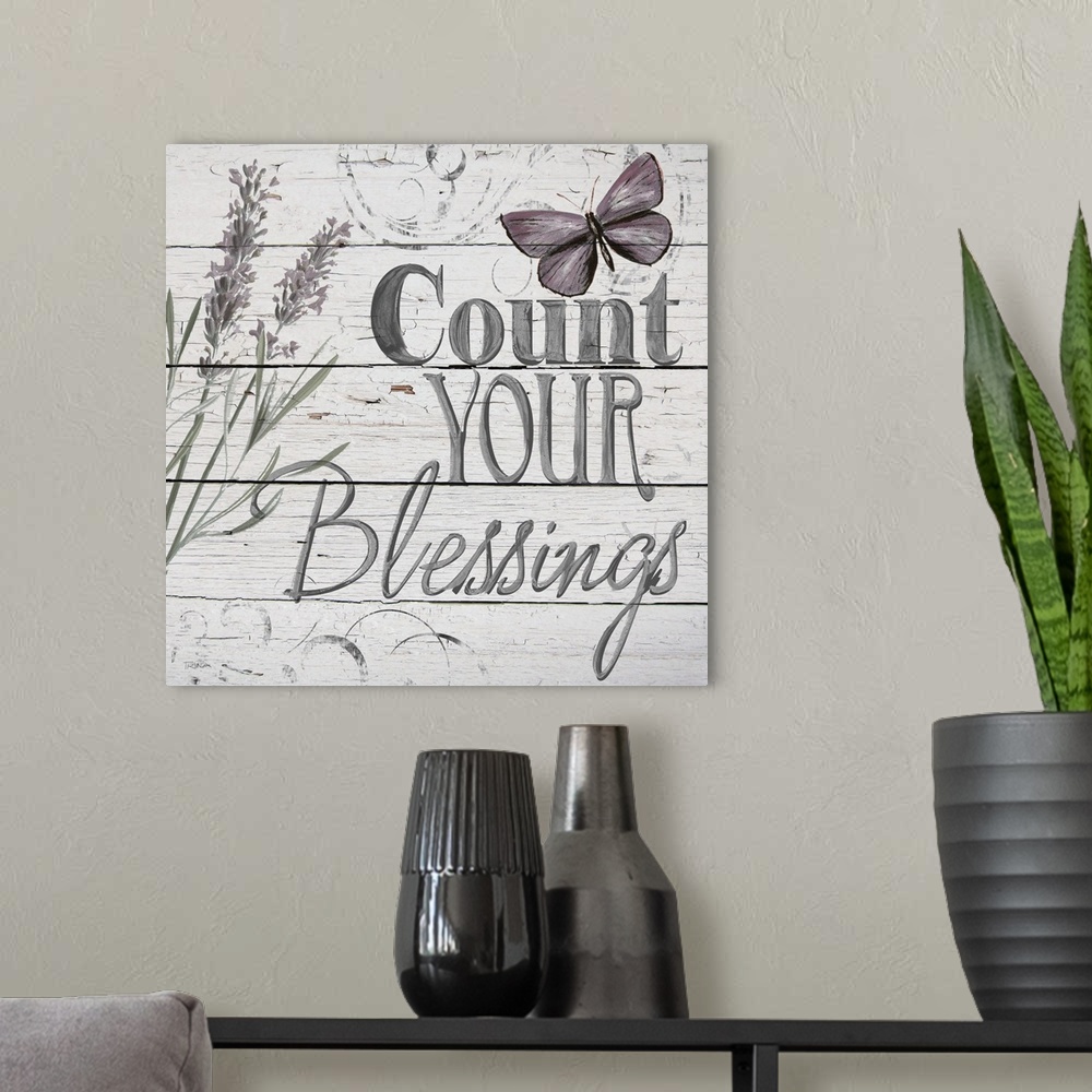 A modern room featuring "Count Your Blessings" handwritten on distressed shiplap.