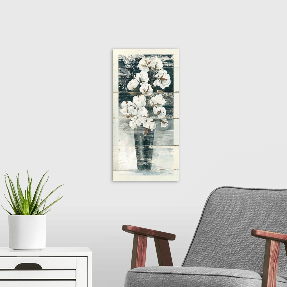 A modern room featuring Long vertical artwork of a vase full of cotton bulbs with a rustic effect on white wood backdrop.
