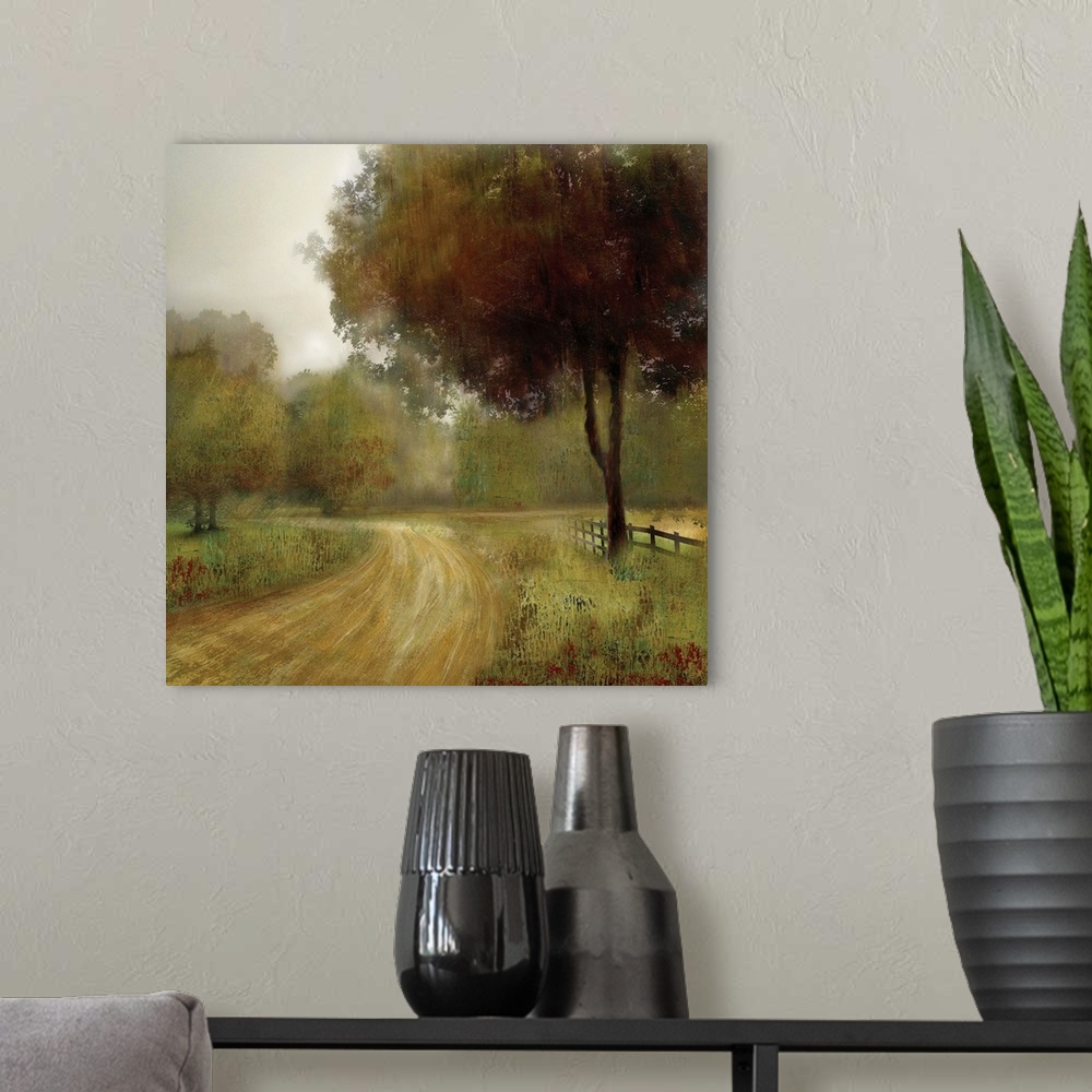 A modern room featuring A square artwork of a road going by a fenced field and tree.
