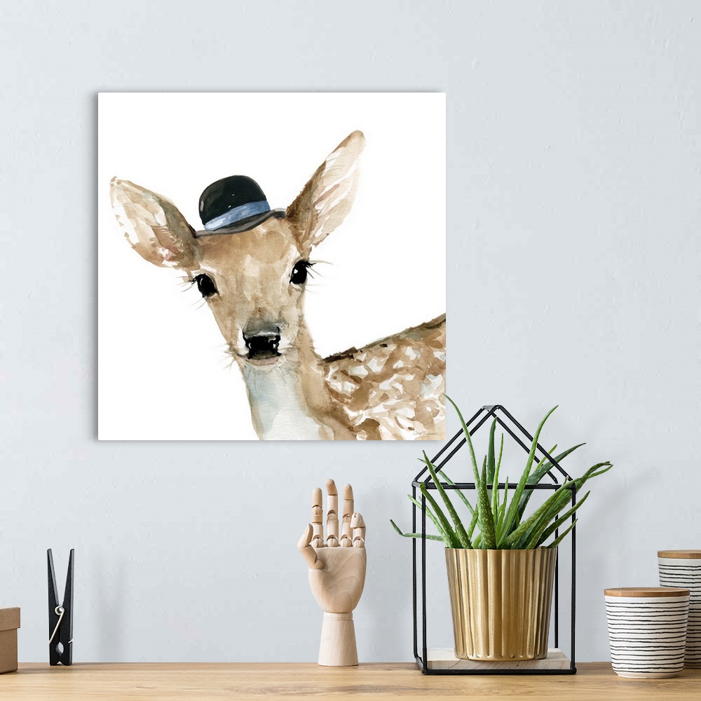 A bohemian room featuring Watercolor painting of a doe wearing a small black hat with a blue stripe on a white square backg...