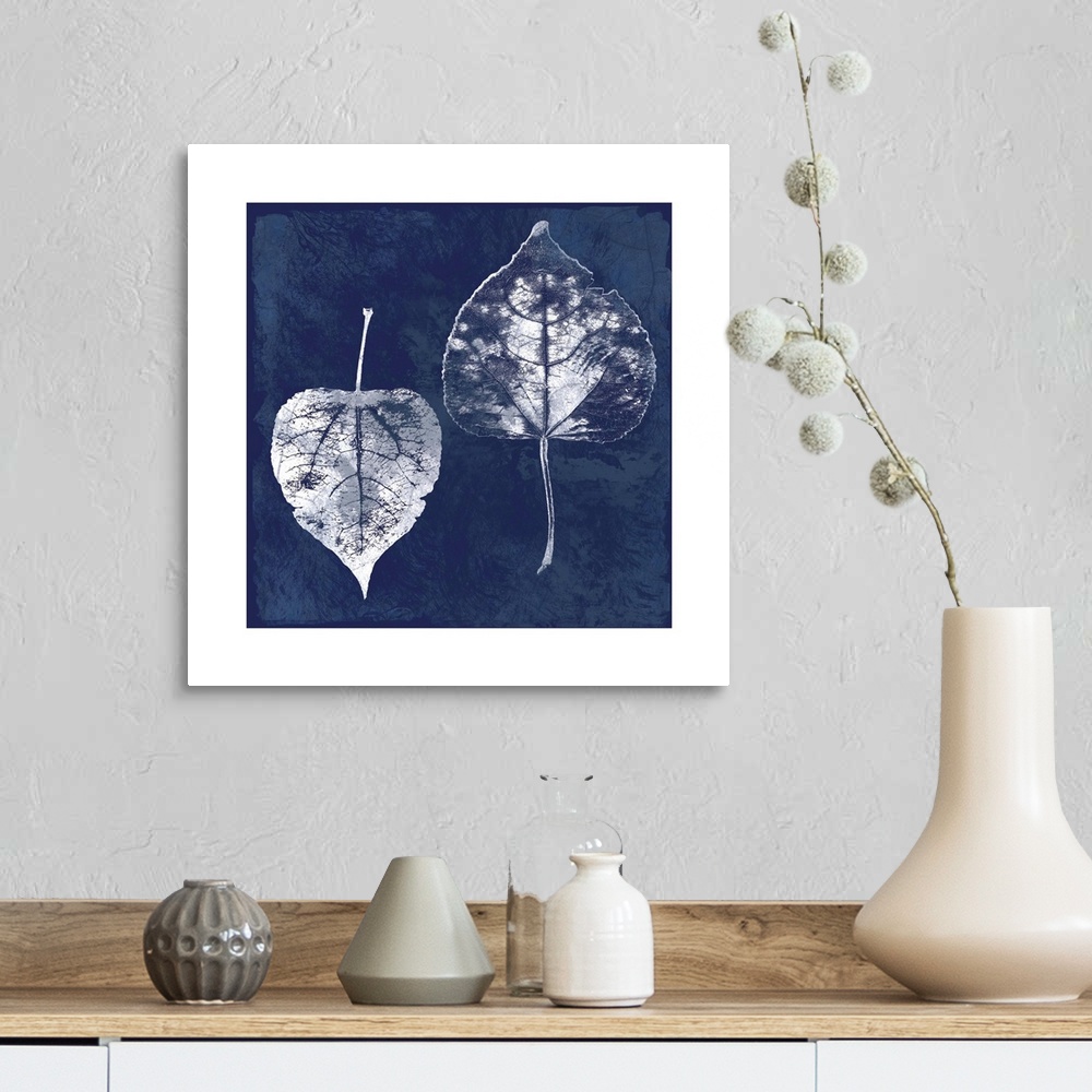 A farmhouse room featuring Square cyanotype of white silhouetted leaves on an indigo background with a white boarder.