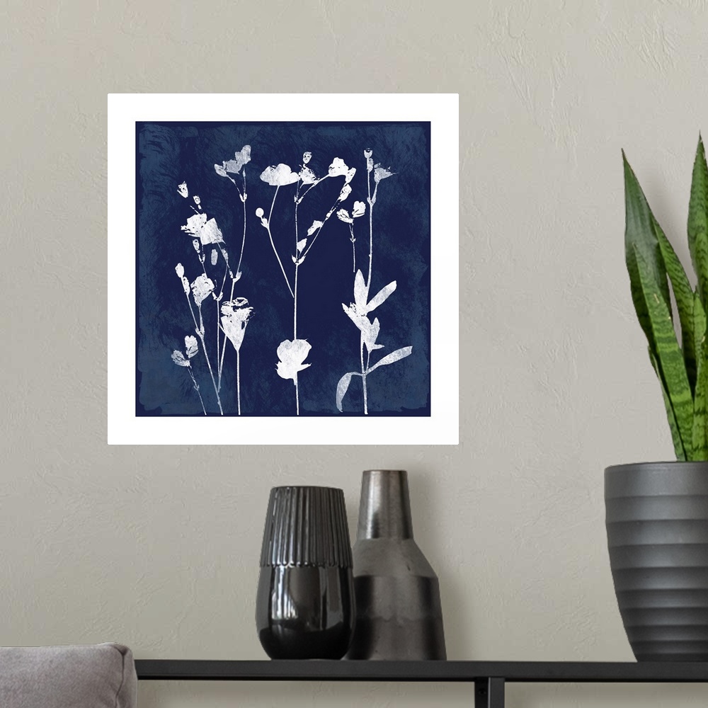A modern room featuring Square cyanotype of white silhouetted flowers on an indigo background with a white boarder.