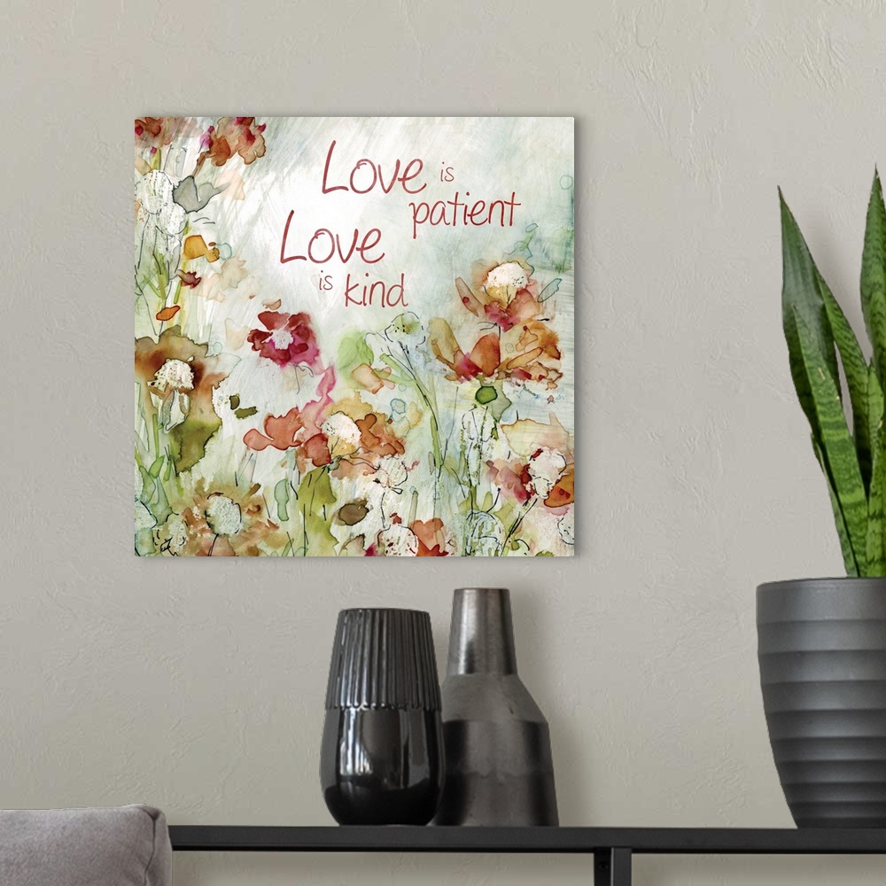 A modern room featuring Decorative watercolor artwork of a group of flowers with the text "Love is Patient, Love is Kind".