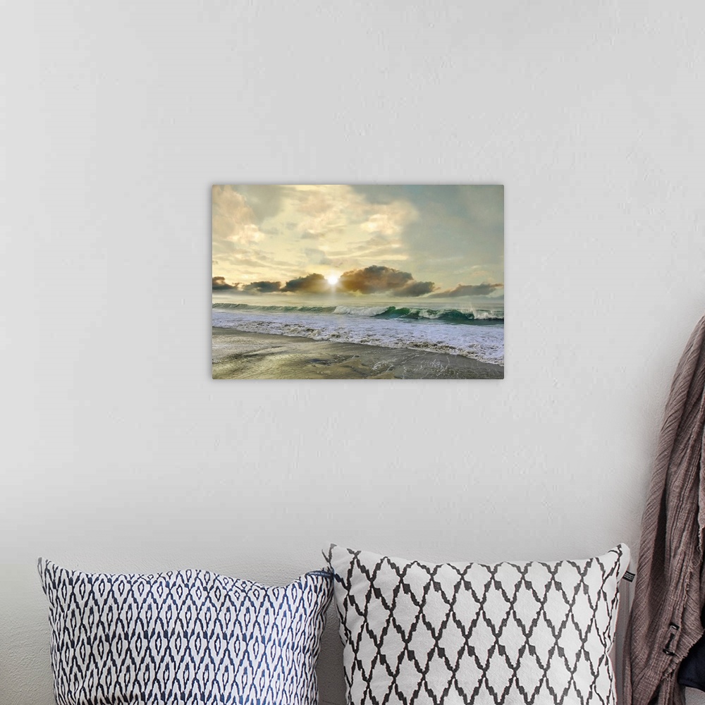 A bohemian room featuring A photo with a semblance of a painting displays rolling waves upon a shore with a sun setting in ...