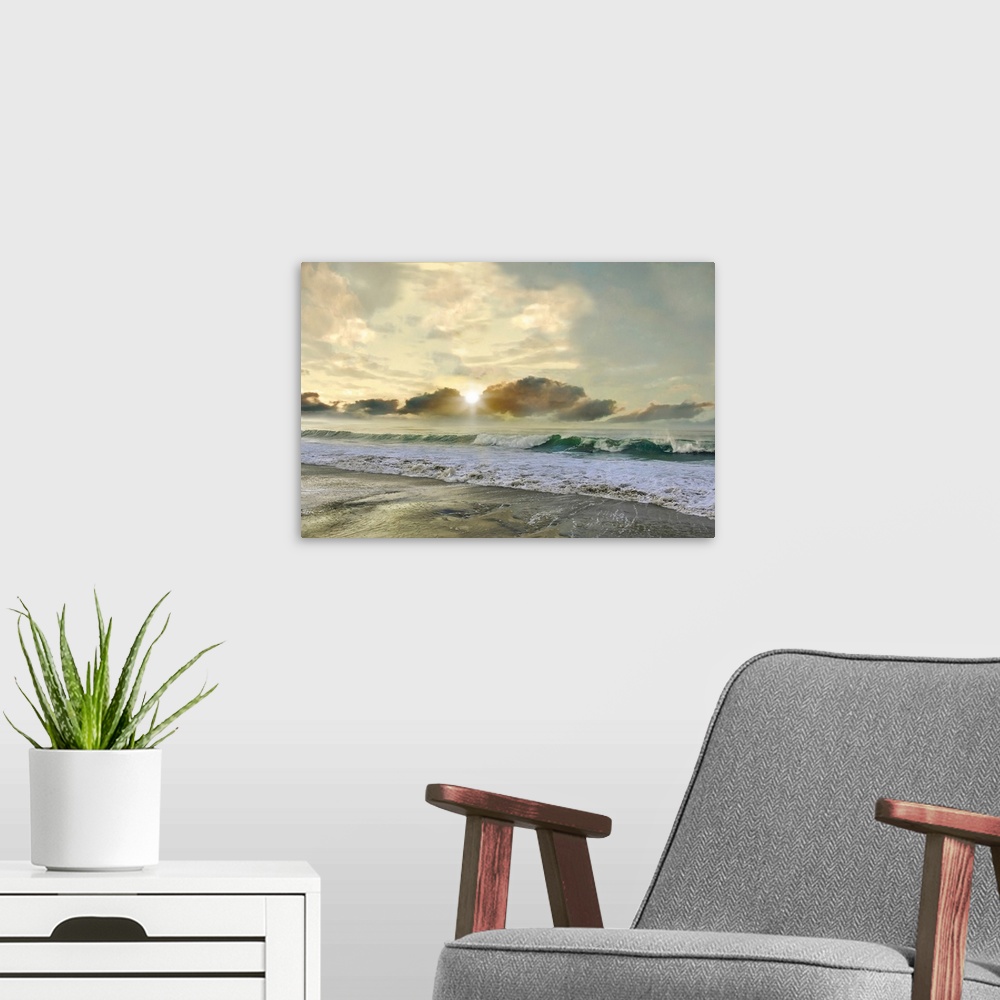 A modern room featuring A photo with a semblance of a painting displays rolling waves upon a shore with a sun setting in ...
