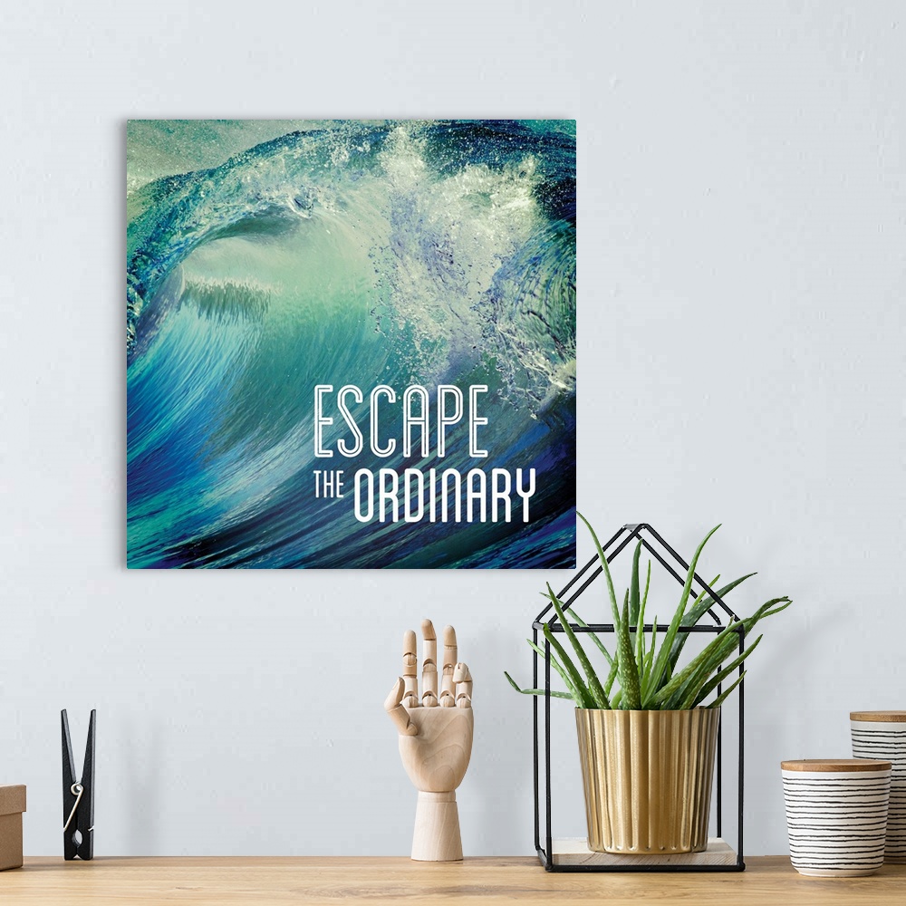 A bohemian room featuring Square photograph of a giant wave with the phrase "Escape the Ordinary" written on the bottom cor...