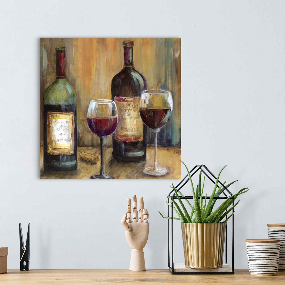 A bohemian room featuring Still life painting of two bottles of wine with glasses on a table.