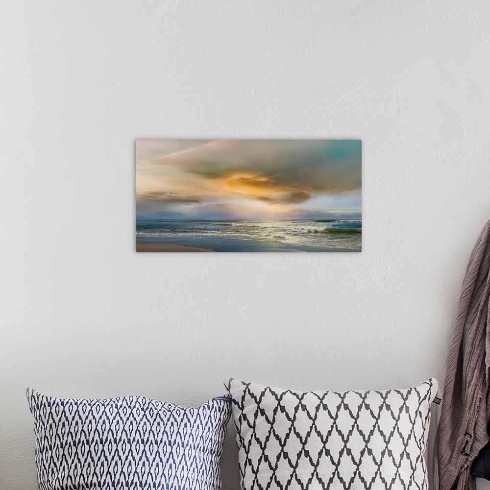 A bohemian room featuring Large photograph of gentle waves on a beach with a colorful sunset.