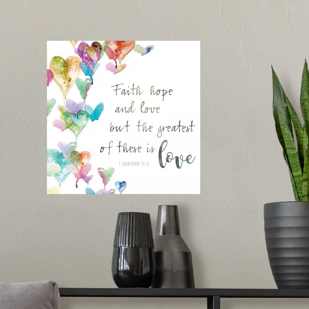 A modern room featuring "Faith, hope and love. But the greatest of these is love, 1 Corinthians 13:13" placed on a white ...