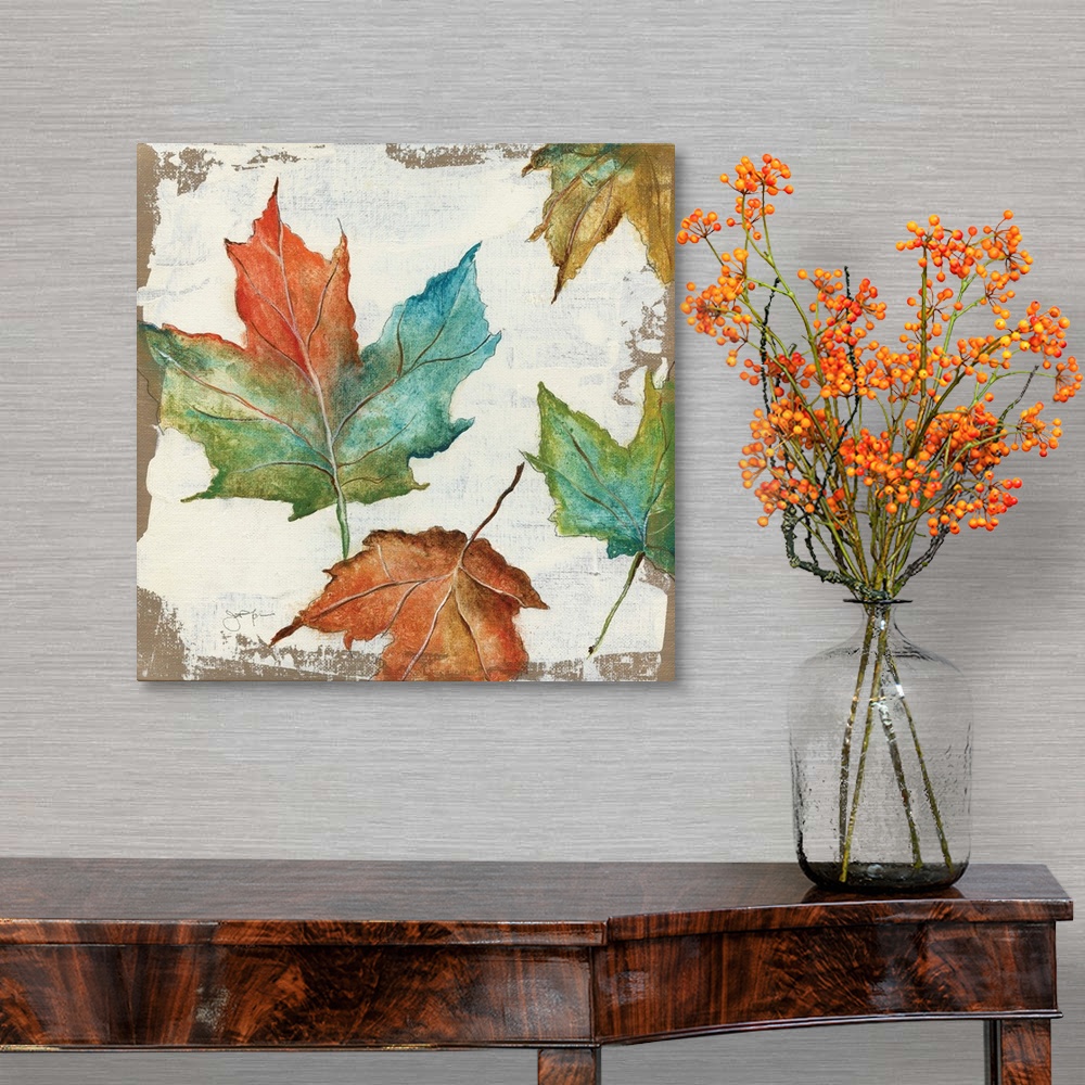 A traditional room featuring Autumn home decor artwork with multicolored Fall leaves.