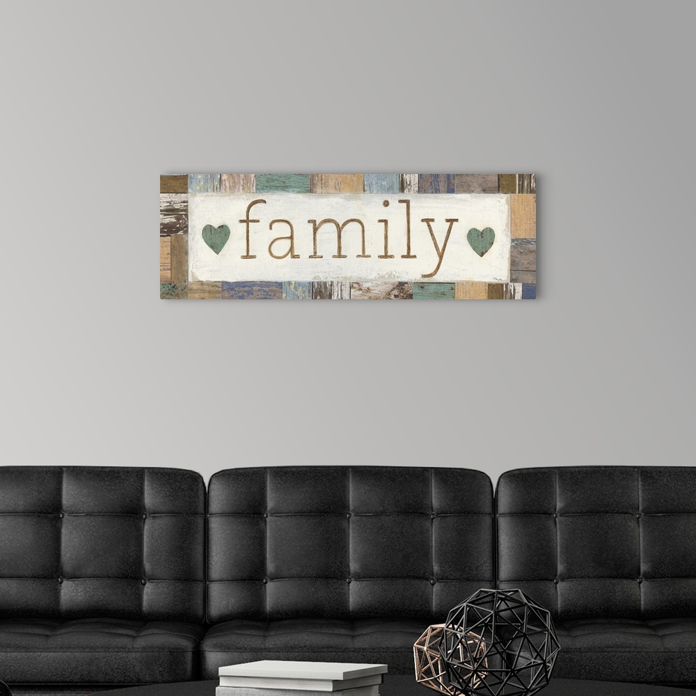 A modern room featuring A decorative painting with the word ?family? painted in the middle with two hearts on either side...