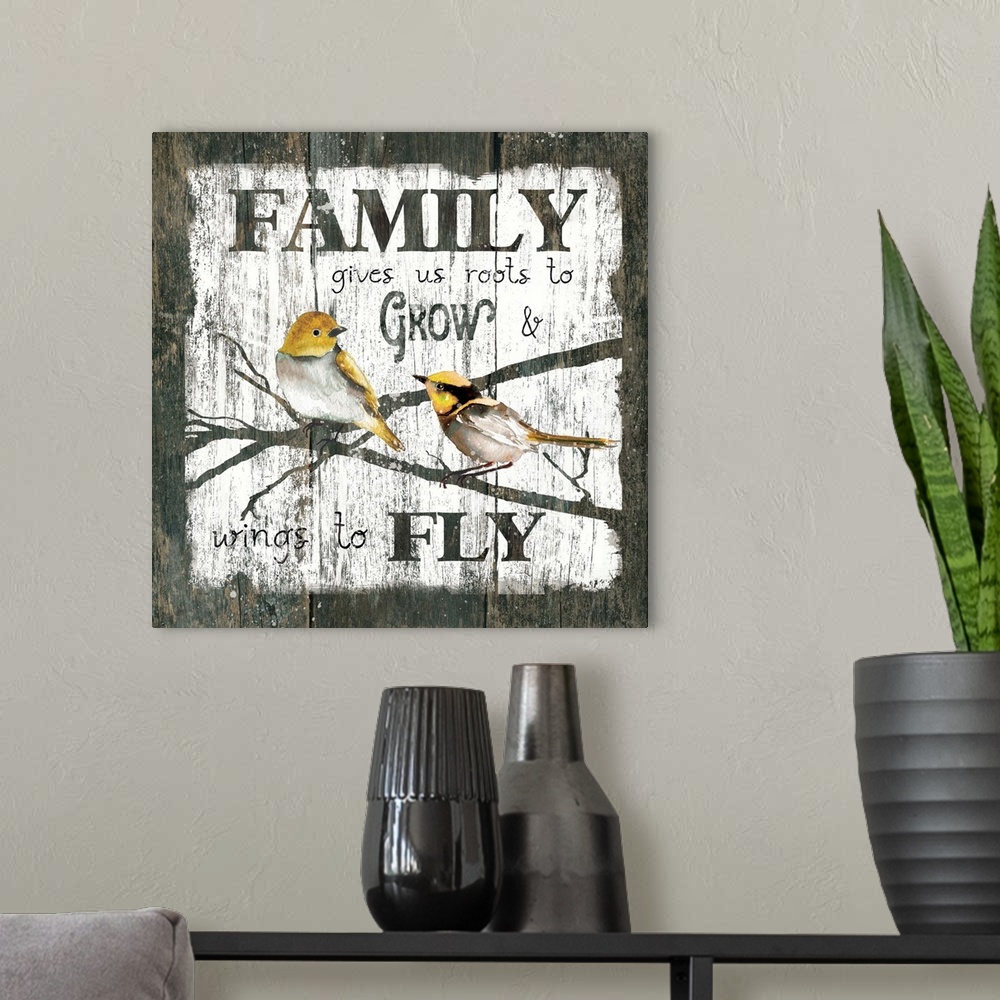 A modern room featuring A decorative painting of two birds sitting on branches and the text ?Family gives us roots to Gro...