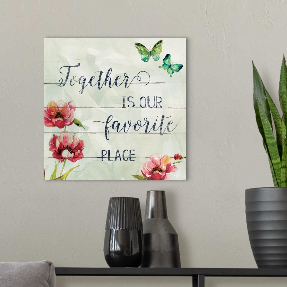 A modern room featuring Decorative watercolor artwork of a group of flowers with the text "Together Is Our Favorite Place".