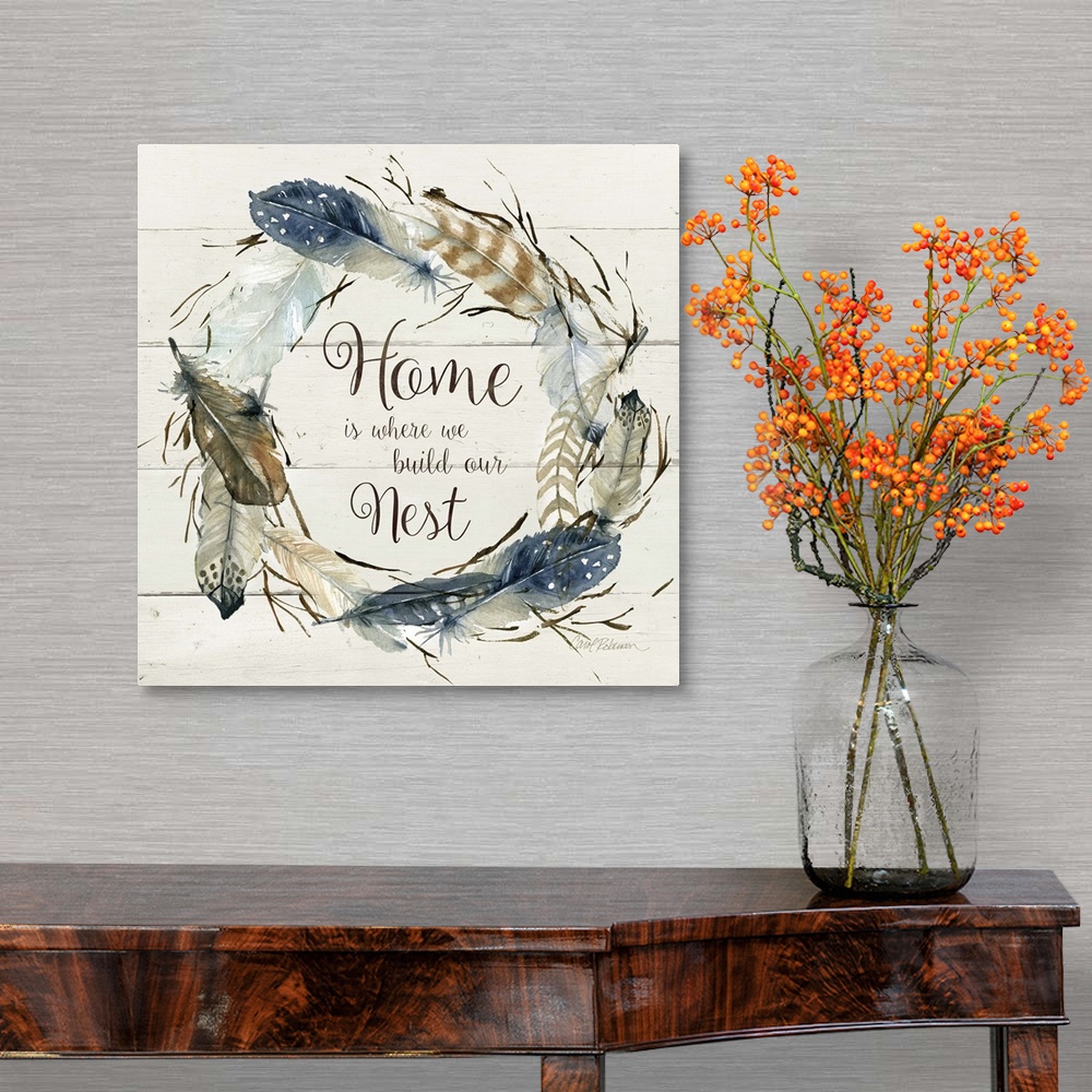 A traditional room featuring Square watercolor painting with a wreath made of feathers and the phrase "Home is Where We Build ...