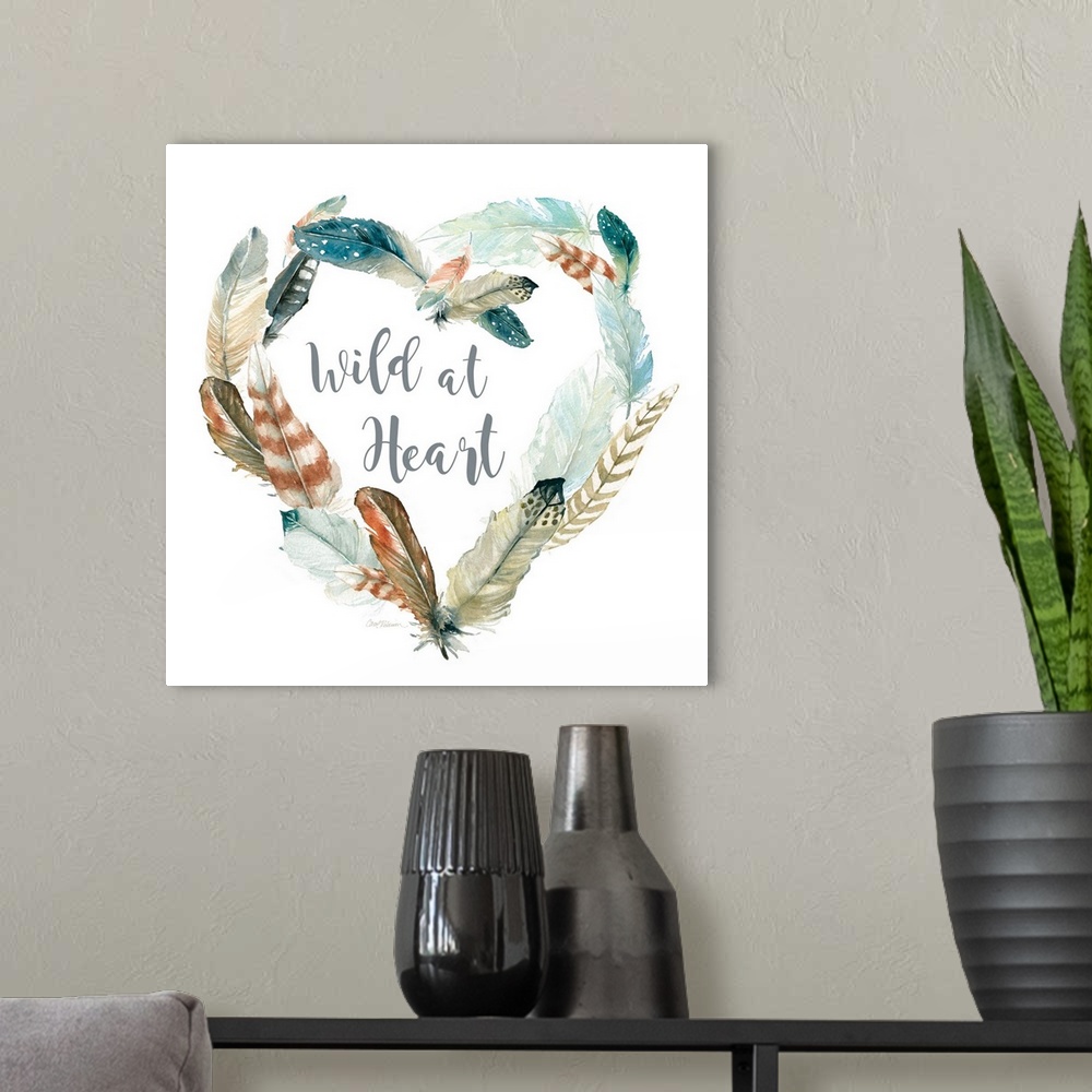 A modern room featuring Square watercolor painting with a heart shaped wreath made of feathers and the phrase "Wild at He...