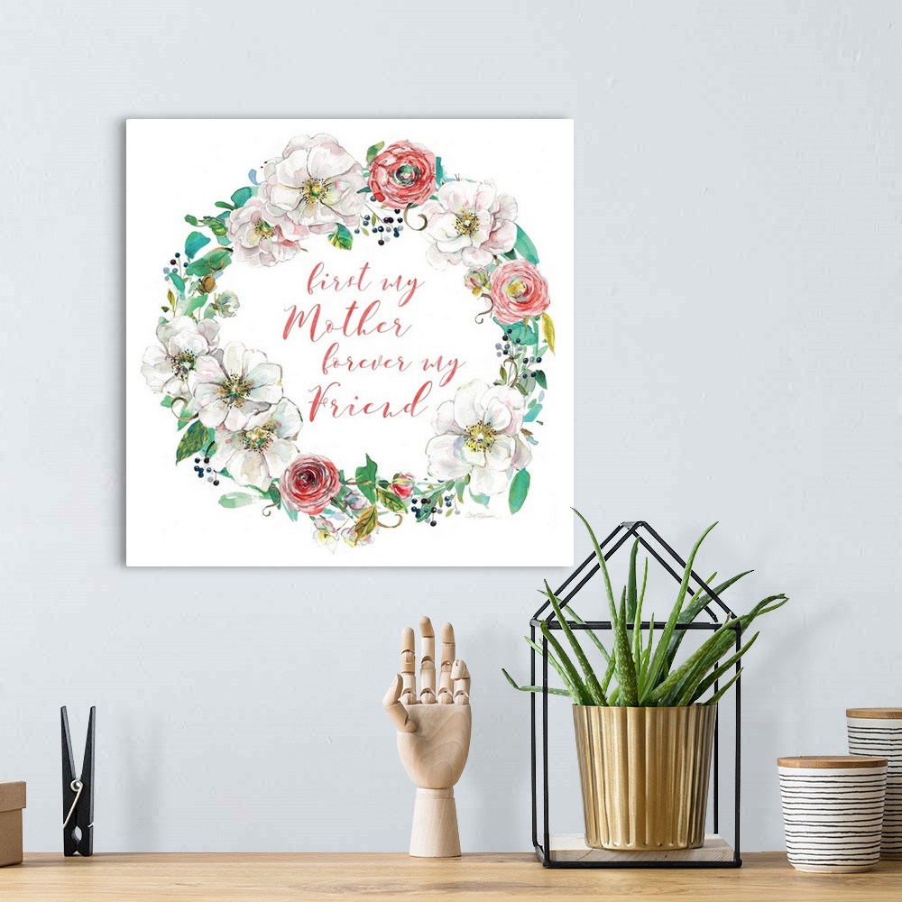 A bohemian room featuring "First My Mother Forever My Friend" written in coral script inside of a watercolor painted wreath...