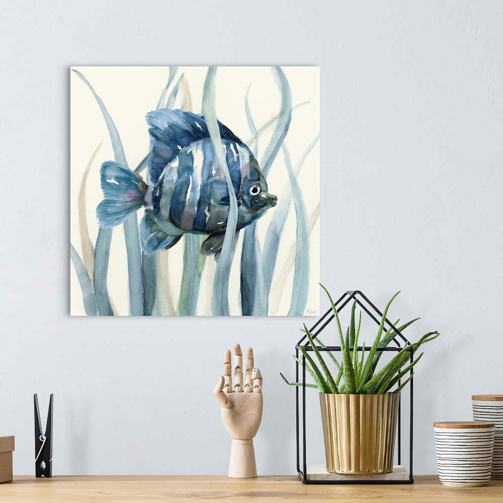 A bohemian room featuring Square indigo watercolor painting of a fish underwater in seagrass on an off white background.