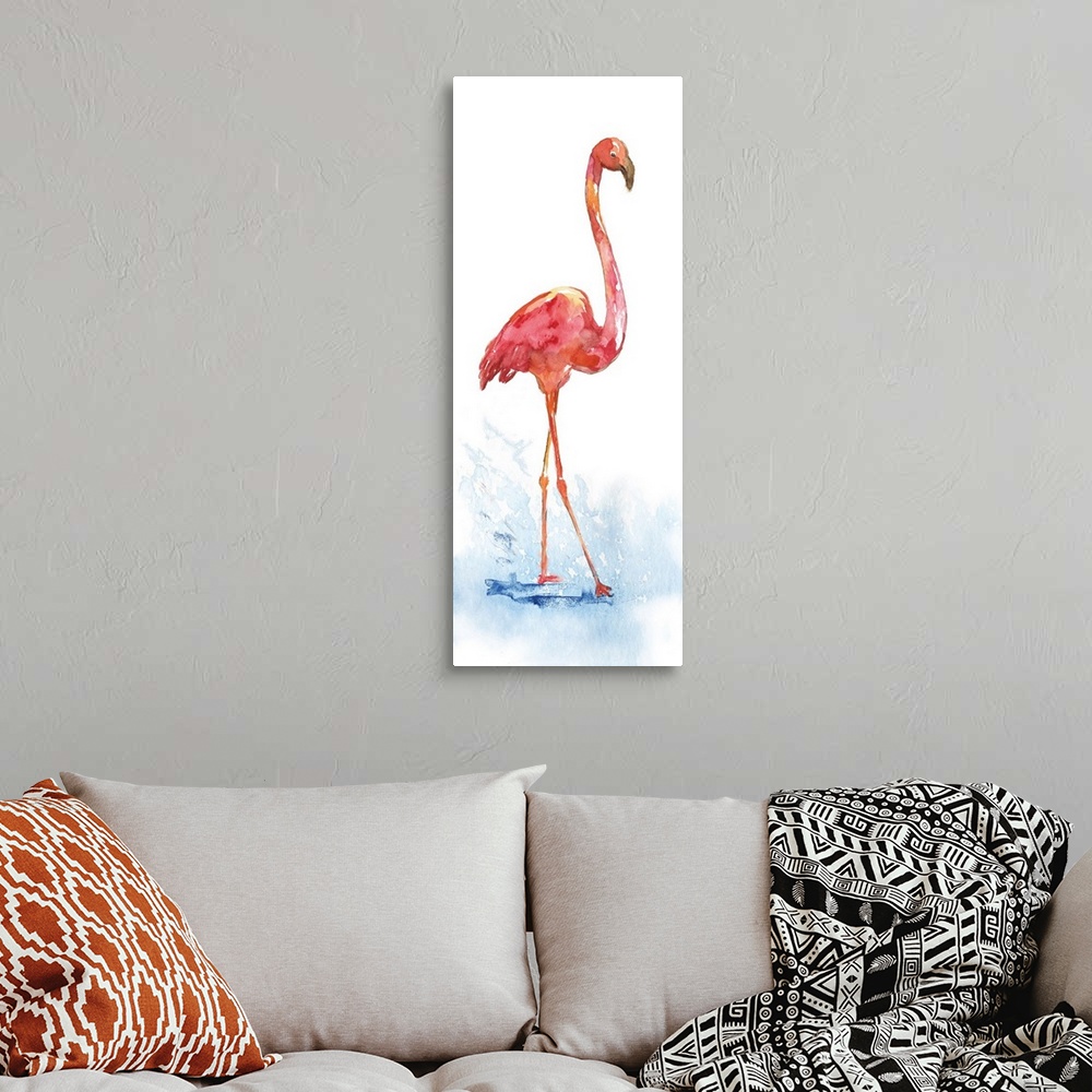 A bohemian room featuring Tall watercolor painting of a single pink flamingo walking through a puddle.