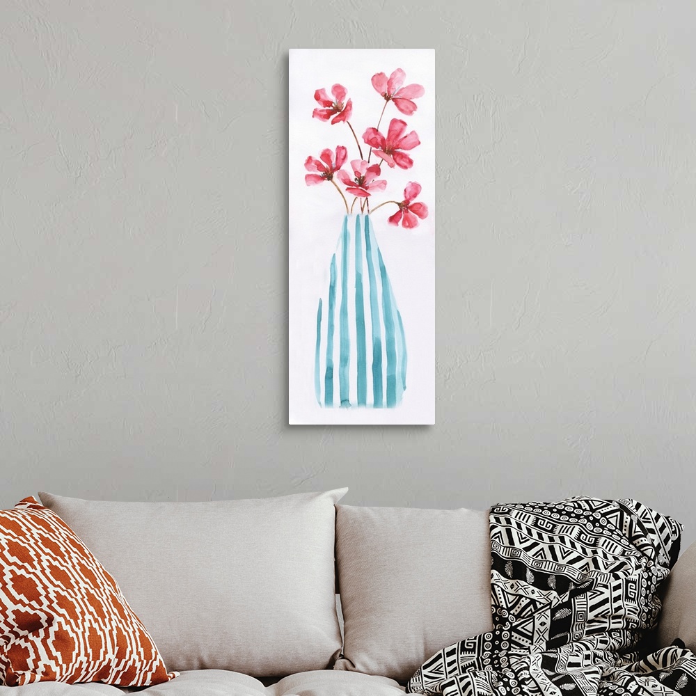 A bohemian room featuring Large panel watercolor painting of pink flowers arranged in a blue and white striped vase on a so...