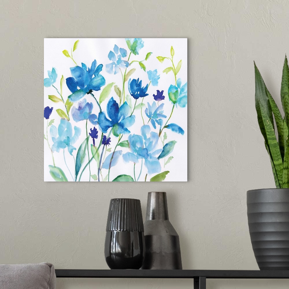 A modern room featuring Bright blue watercolor flowers with green leaves spring up against a white background.