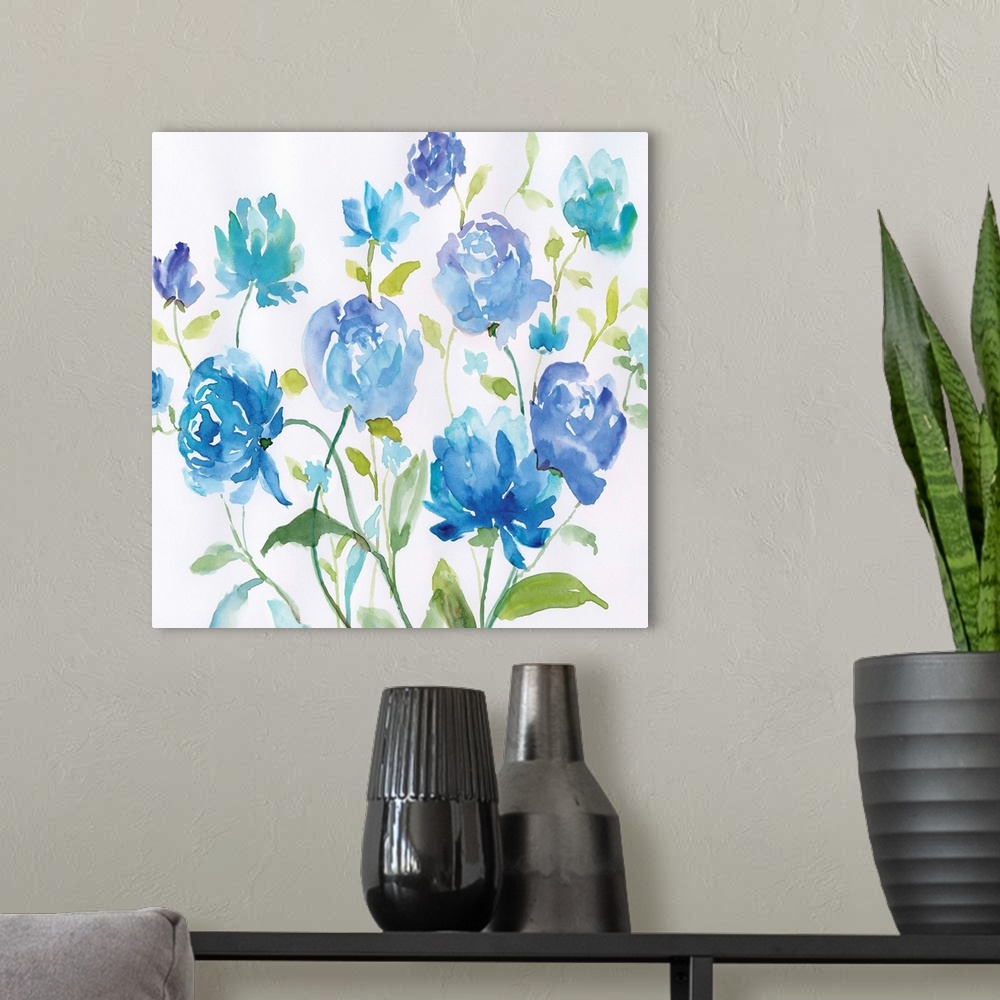 A modern room featuring Bright blue watercolor flowers with green leaves spring up against a white background.