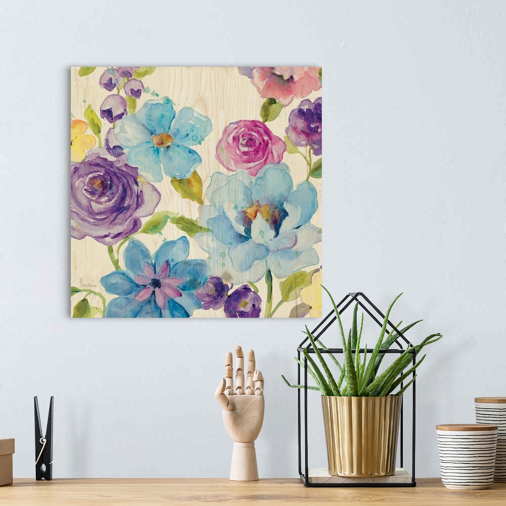 A bohemian room featuring A watercolor painting of different colored flowers on a light wooden background.