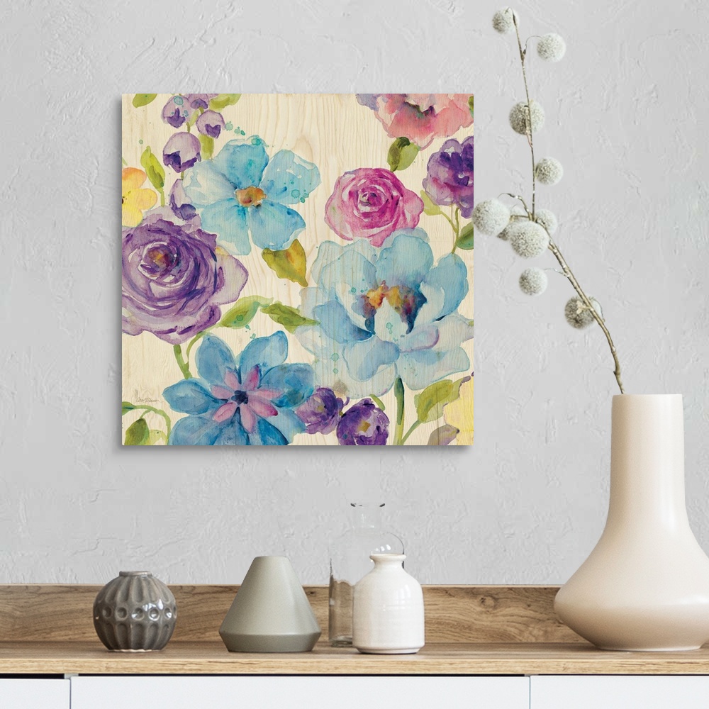 A farmhouse room featuring A watercolor painting of different colored flowers on a light wooden background.
