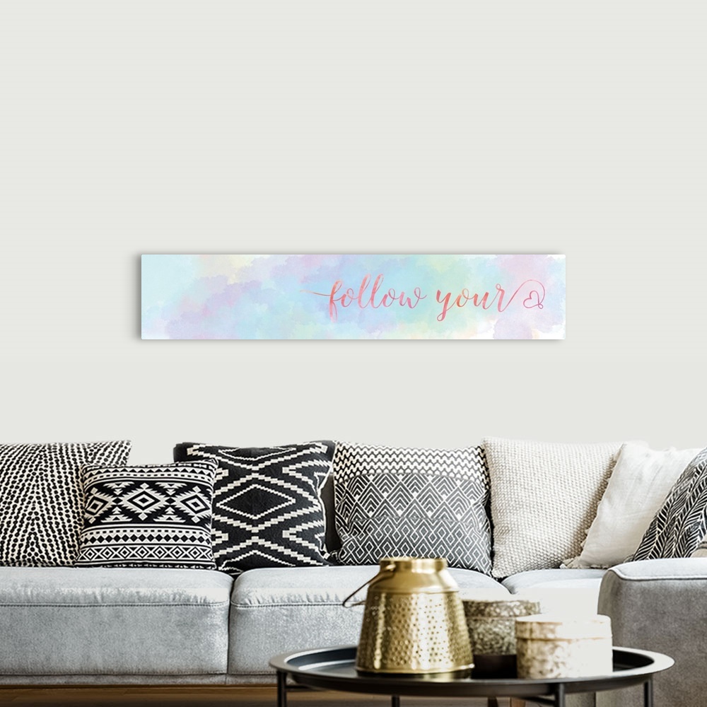 A bohemian room featuring A long horizontal design of pastel colors with the words "Follow your" and a heart shape.