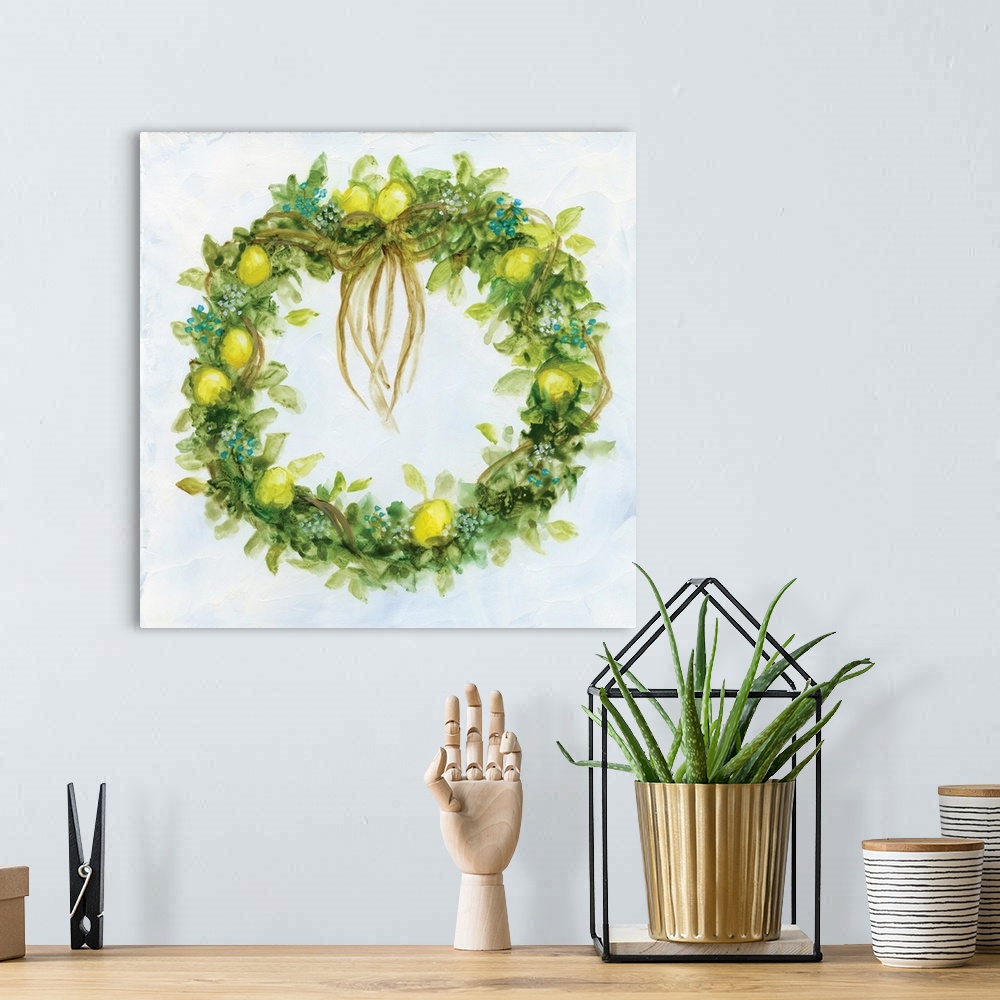 A bohemian room featuring Artwork of a leafy green wreath decorated with ribbons and lemons.