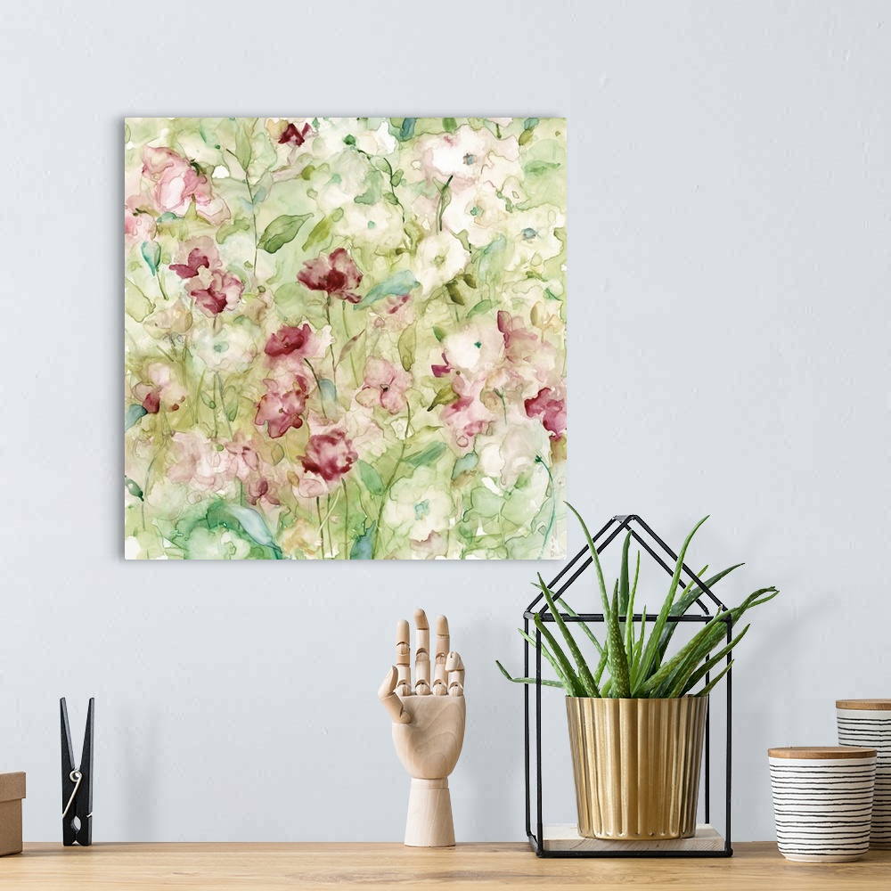 A bohemian room featuring Decorative watercolor artwork of a group of flowers in shades of pink and green.