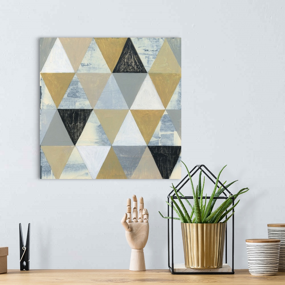 A bohemian room featuring Geometric abstract art with triangular shapes coming together to create a pattern in shades of gr...