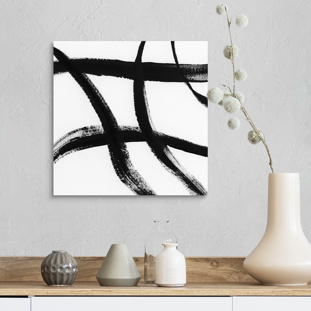 A farmhouse room featuring Square black and white abstract painting with thick, bold, crossing lines.
