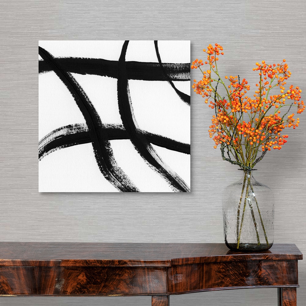 A traditional room featuring Square black and white abstract painting with thick, bold, crossing lines.
