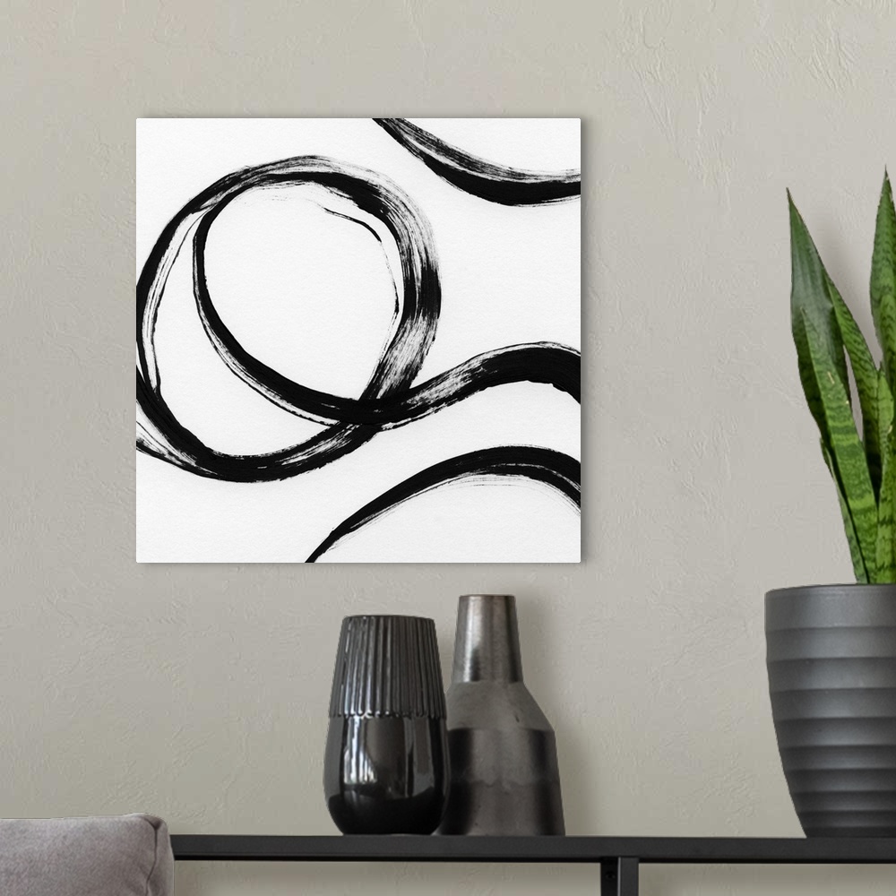 A modern room featuring Square black and white abstract painting with thick, bold, curvy lines.