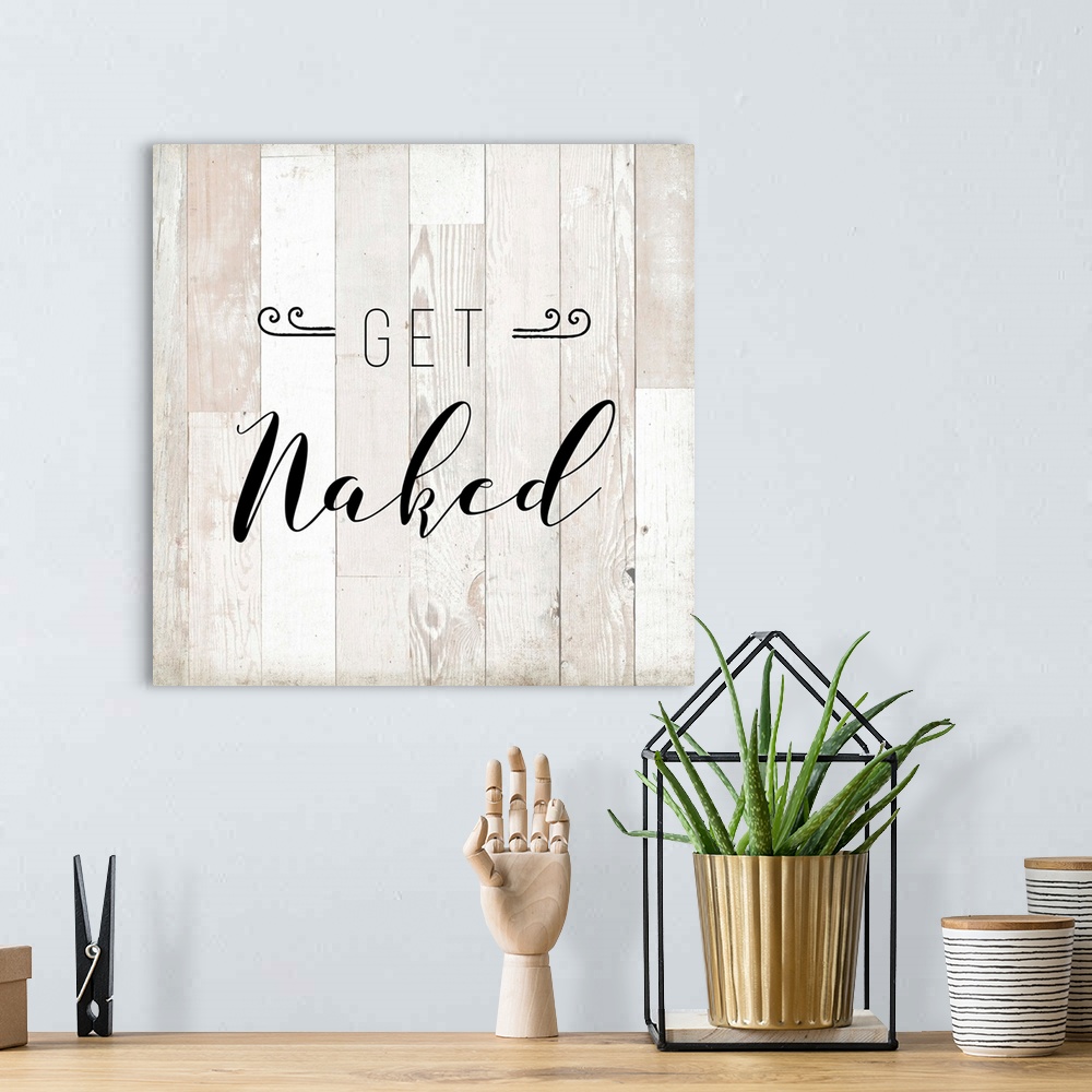 A bohemian room featuring The words "Get Naked" are playfully placed on vertical white shiplap with distressed texture span...