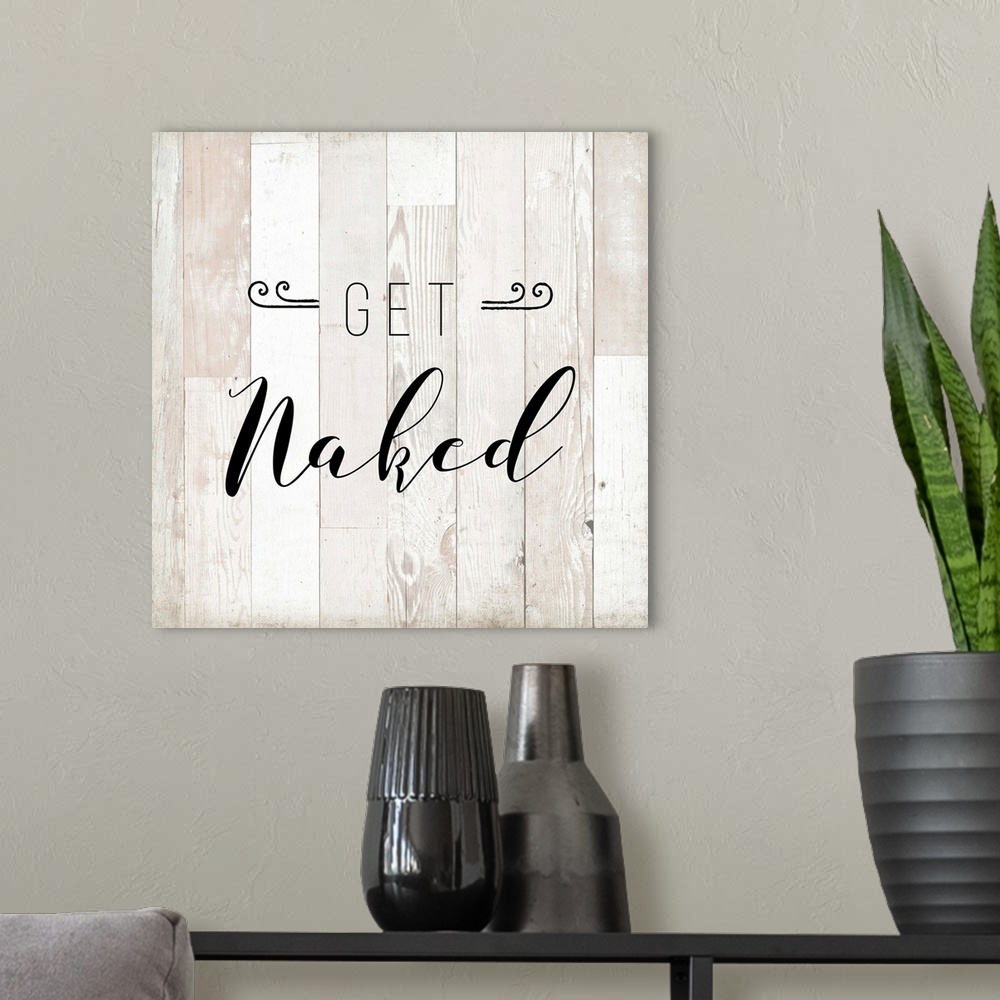 A modern room featuring The words "Get Naked" are playfully placed on vertical white shiplap with distressed texture span...