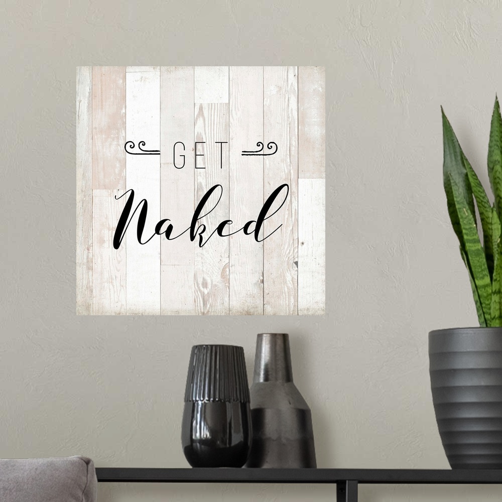 A modern room featuring The words "Get Naked" are playfully placed on vertical white shiplap with distressed texture span...