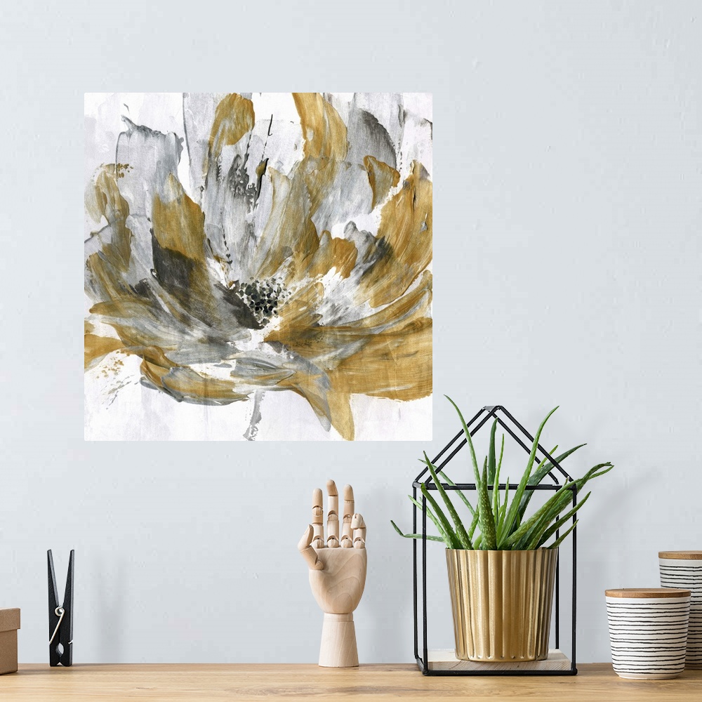 A bohemian room featuring Square abstract painting of a gold and silver flower.