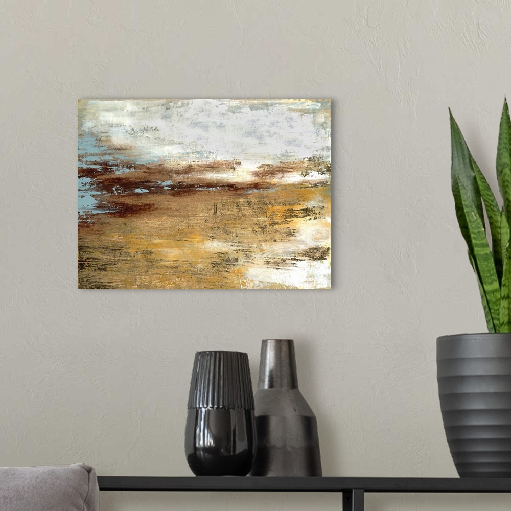 A modern room featuring Abstract contemporary painting in gold and grey, resembling a landscape at sunset.