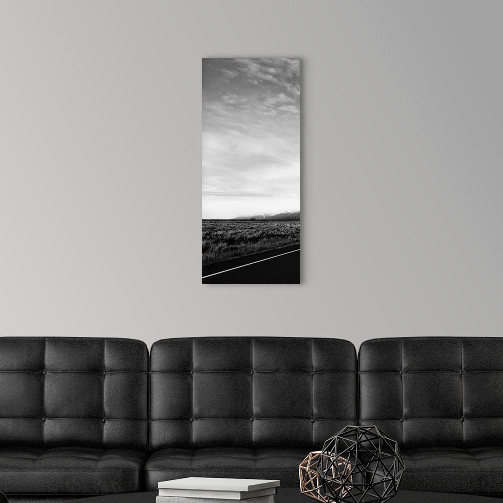 A modern room featuring One photo in a series of three taken on  a road to Grand Teton.