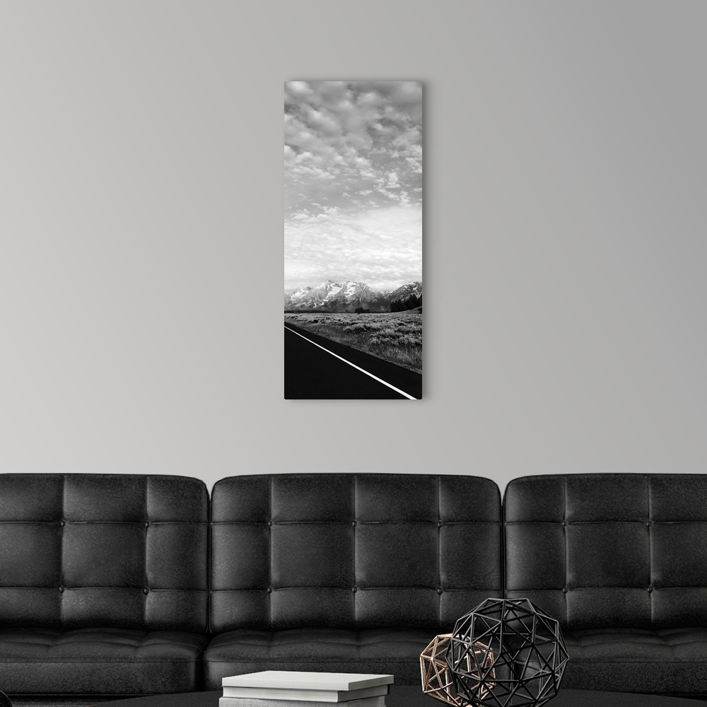 A modern room featuring One photo in a series of three taken on  a road to Grand Teton.