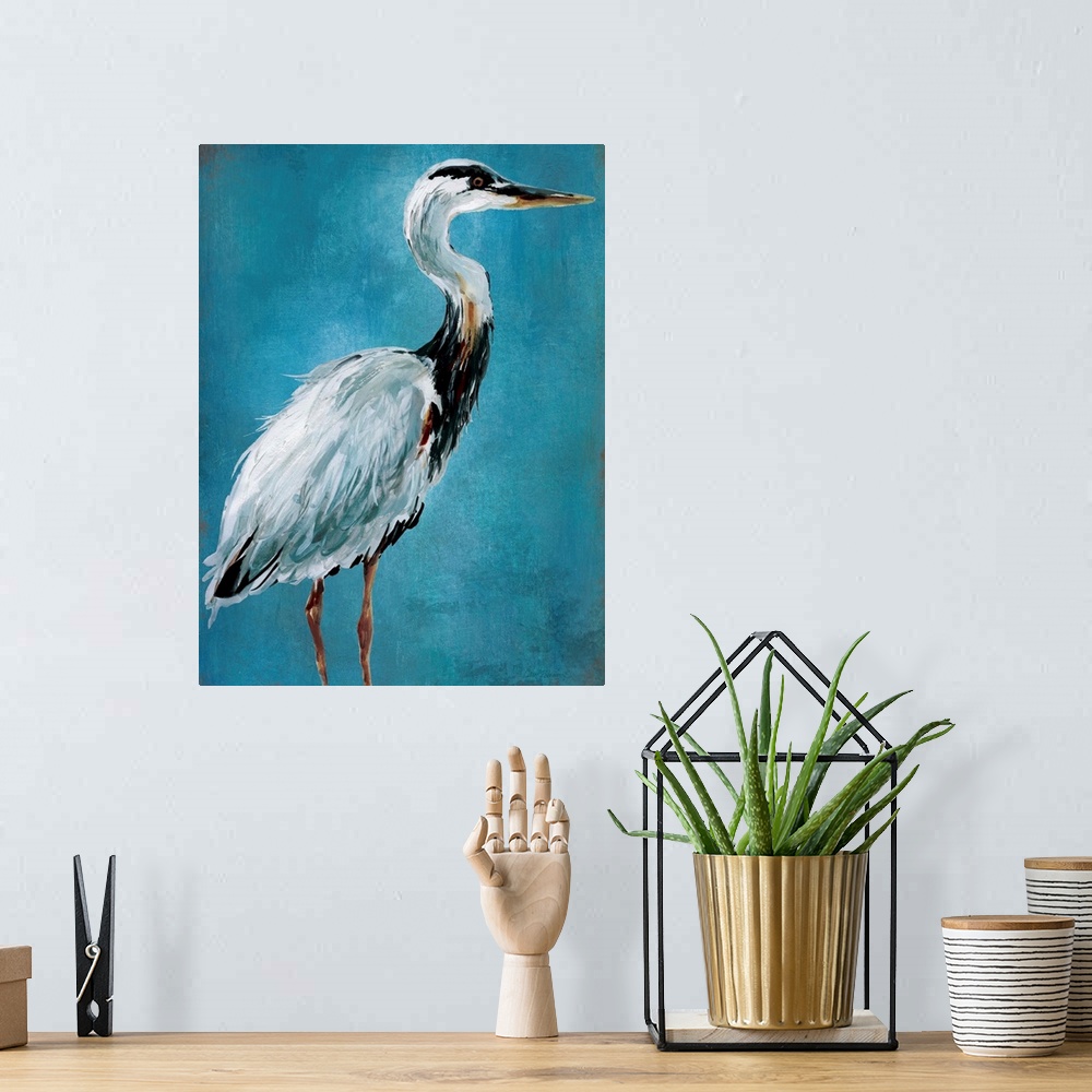 A bohemian room featuring Contemporary painting of a blue heron on a blue background.