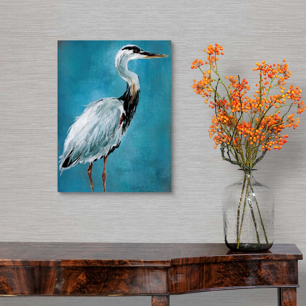 A traditional room featuring Contemporary painting of a blue heron on a blue background.