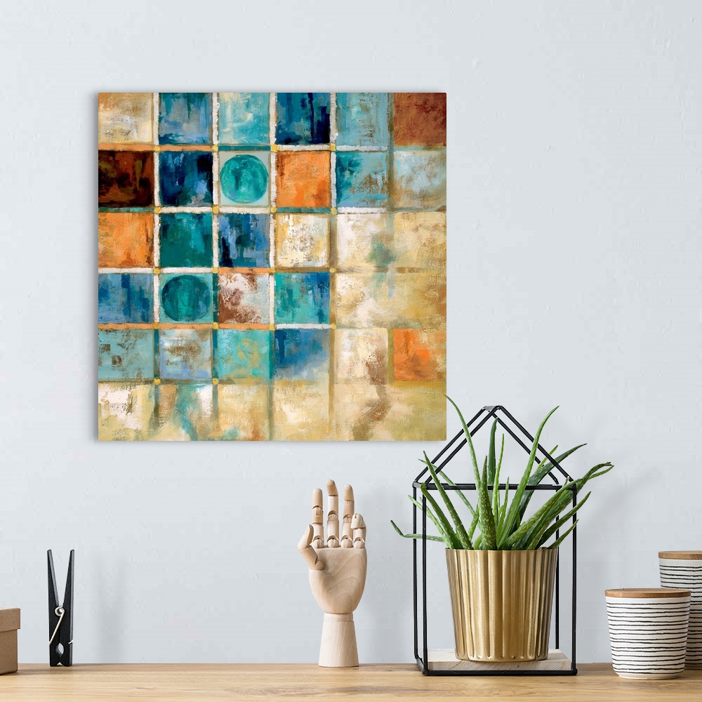 A bohemian room featuring A contemporary painting using geometric shapes.
