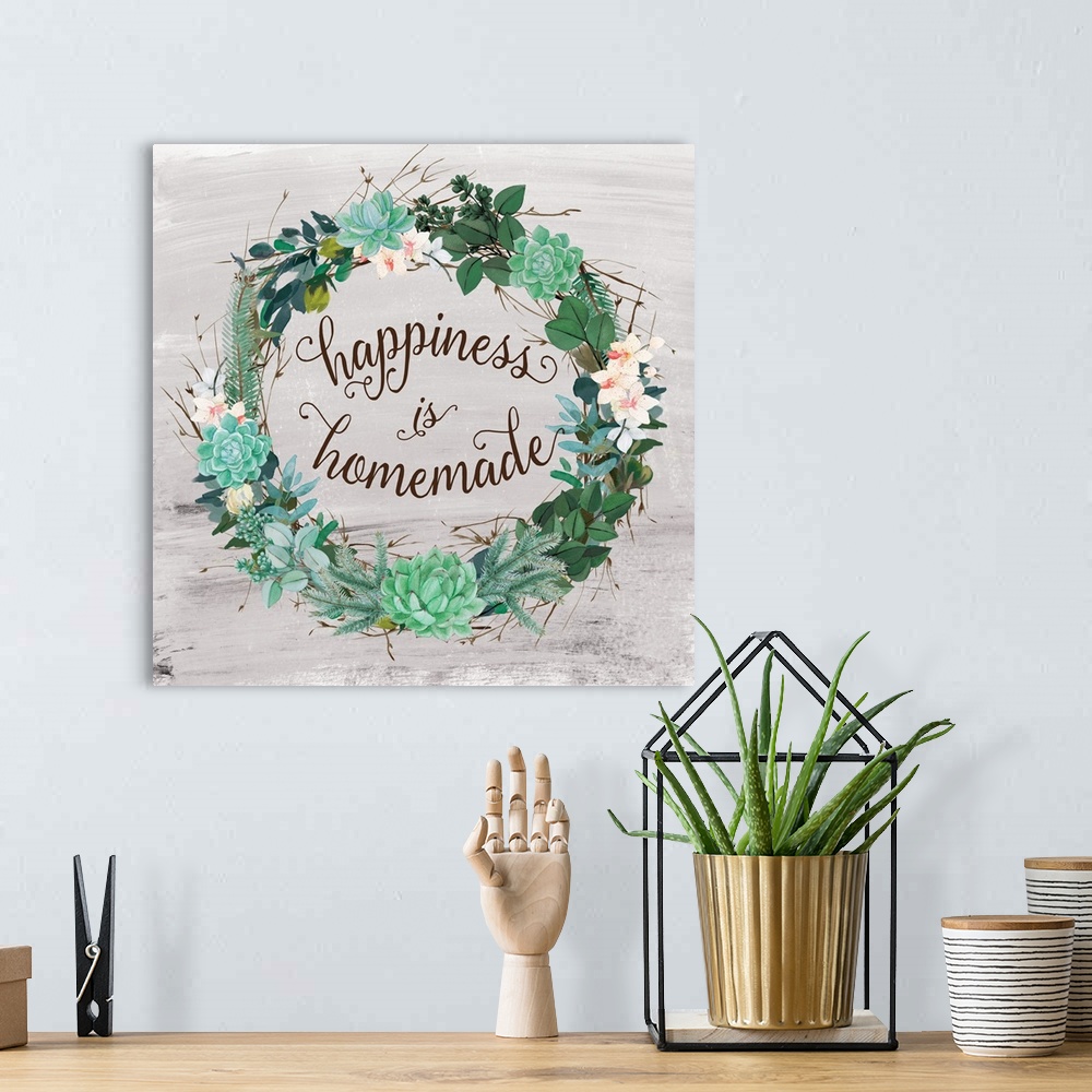 A bohemian room featuring A wreath of succulents, various flowers and foliage surround the words, "Happiness is Homemade".