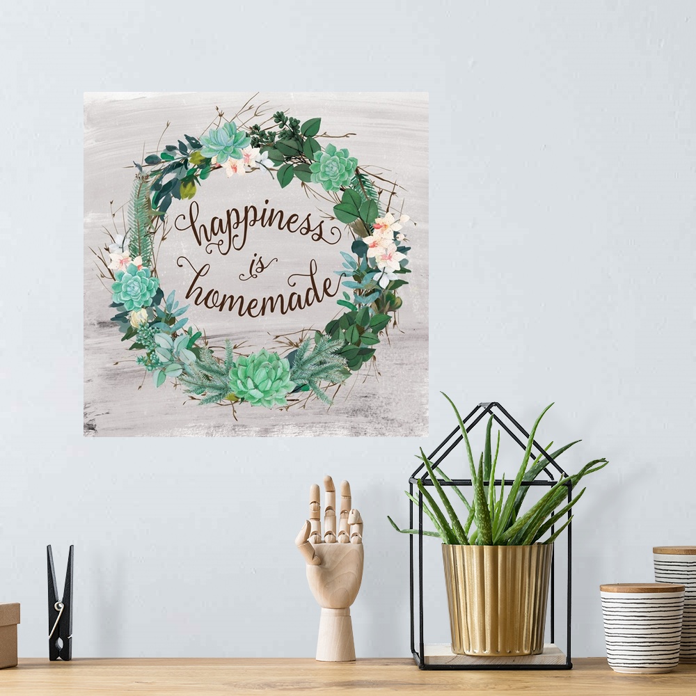 A bohemian room featuring A wreath of succulents, various flowers and foliage surround the words, "Happiness is Homemade".
